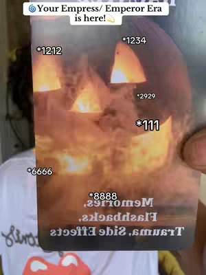 A person's hand holding a card with a carved pumpkin design on it that is lit up by orange light from within, and the numbers like *1212, *1234, *2929, *111, *6666 and *8888 covering the background.