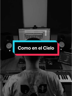 A grayscale cover image with a person seen from behind sitting in front of music production equipment. A text overlay in a teal and red box reads 'Como en el Cielo'. The background is dark, and studio monitors and a keyboard are visible.