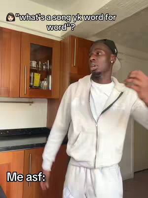 A man in a white hoodie and sweatpants is standing in a kitchen. Text overlays on the cover image. The background features brown wooden cabinets, a black countertop, and a window.