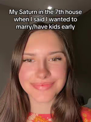 A close-up shot featuring a young woman with long, brown hair and a subtle smile. She wears a colorful top. Above her, white text overlays, beginning with "My Saturn in the 7th house"