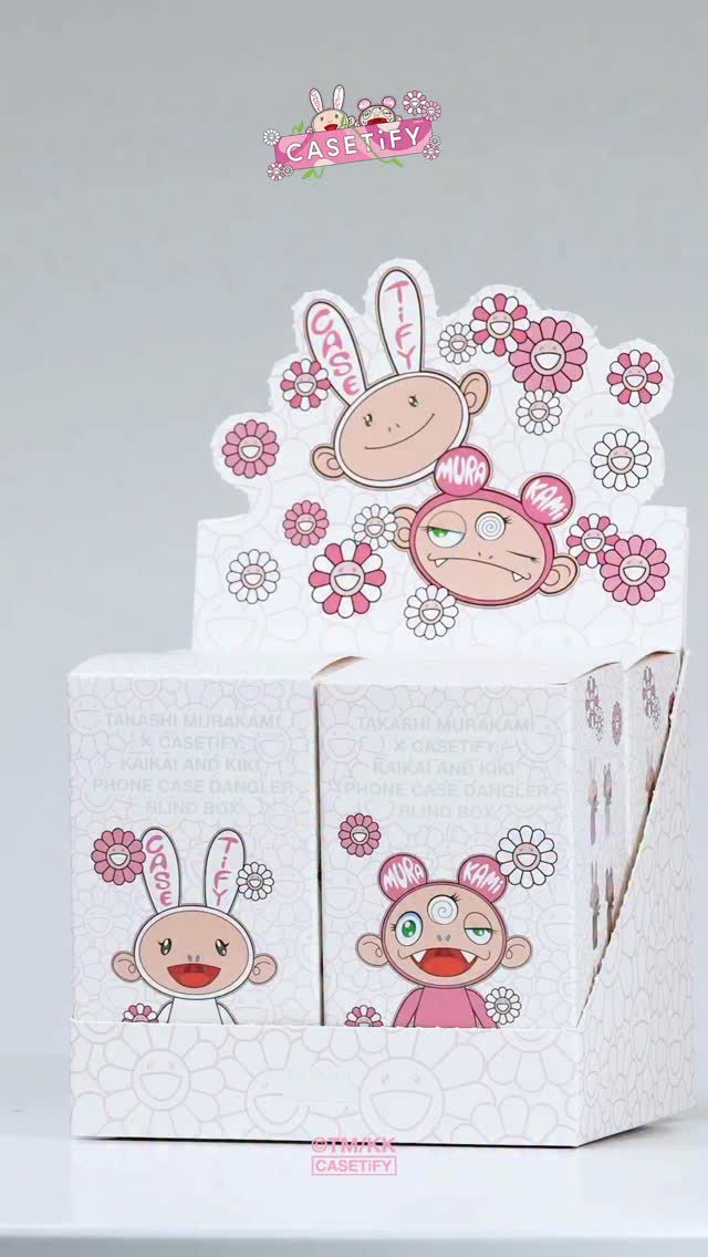 The cover image showcases a display of CASETiFY x Takashi Murakami collaboration products. The focal point is a multi-tiered cardboard display filled with boxes adorned with Murakami's signature flower and character designs, with the CASETiFY logo.