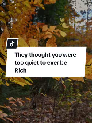 The cover image shows vibrant autumn foliage with green and yellow leaves filling the frame. A white rectangle with black bordered text saying, 'They thought you were too quiet to ever be Rich' is placed against the background with a TikTok logo in the top left-hand corner.
