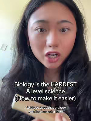 A selfie-style video cover shows a young woman with long, dark hair, looking directly at the camera and talking. Text overlays are present, with the primary text reading, "Biology is the HARDEST A level science (How to make it easier)." Additional text appears below, stating, "I told you guys that biology was the hardest a level."