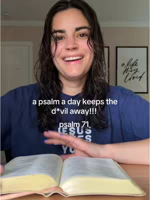 A woman with dark hair and a blue shirt is smiling and holding an open book, with text overlaid on the image.