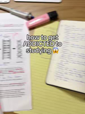 The image shows an arrangement of study materials on a wooden surface. A sheet of notes with diagrams and writing is visible on the left. A pink highlighter and a pen lay on top of the notes. A notebook is open with handwritten notes on the right side of the image. The central focus of the image is a text overlay that reads: “how to get ADDICTED to studying” set in a casual font.