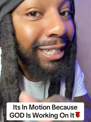The cover image features a smiling Black man with a full beard and locs facing the camera. A text overlay at the bottom reads, 'Its In Motion Because GOD Is Working On It🌹'.