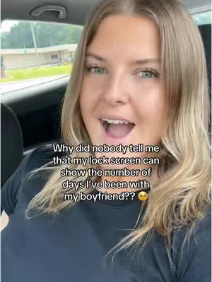 A woman with blonde hair and green eyes is inside a car, looking directly at the camera with an open mouth. Overlayed text indicates she is talking about days spent with her boyfriend.