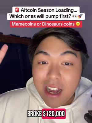 A selfie-style video cover with a young Asian man in a white hoodie. The image is brightly lit, focusing on his face. Overlay text highlights a question about meme coins and dinosaur coins in a crypto context. The man is smiling and gesturing with his hand.