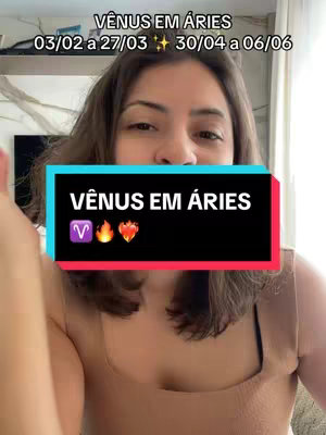 A selfie-style video cover features a woman facing the viewer, the upper portion of her body visible. A text overlay in a teal box declares, 'VÊNUS EM ÁRIES', with dates and symbols above a second text box. The woman wears a light-colored top, and the background is softly blurred, suggesting an indoor setting. The layout is simple with a focus on the text overlaid on the woman.