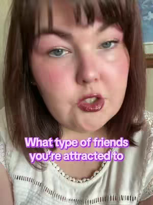 A close-up shot of a woman's face, with the focus on her expression and the overlaid text. She has dark hair that is parted to the side and the image has good lighting that highlights her features. She is wearing a white top with a detailed neckline.