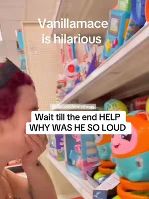 A person with red hair partially obscures their face while looking at a shelf of colorful toys. Text overlays appear at the top and bottom of the image, with toys brightly displayed in the shelf behind.
