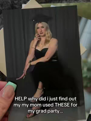 A photograph of a young woman posing in a graduation cap and dress with a background that hints at a photo shoot setting is held in a hand with teal-colored fingernails. The woman is fair-skinned with blonde hair. She is seated, with her hands near her face. Text is overlaid, describing the surprise related to the photograph's use.