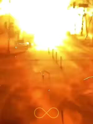 A vertical image with a bright, warm, and possibly abstract or spiritual scene. The background seems to emanate a radiant, golden light that fades into a lighter, almost white, expanse, with what could be a pathway with evenly spaced vertical lines. The lower part of the image is less illuminated, and at the very bottom is an infinity symbol drawn in a light color.