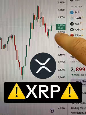 The cover image displays a financial chart on a computer screen, with a finger pointing at a specific data point. Overlaid is a black circle with the XRP crypto symbol and a warning graphic.