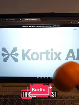 A laptop screen displaying the Kortix AI logo with an orange in front and a text overlay at the bottom.
