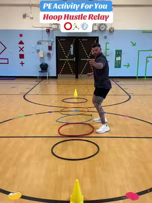 The cover image shows a man in athletic attire standing on a basketball court, gesturing towards the viewer. In the background are various colorful hoops, cones marking a course, and lines typical of a basketball court. At the top is a text overlay indicating the activity.