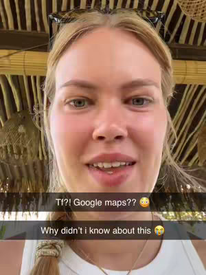 A close-up selfie of a woman with fair skin, blonde hair, and blue eyes. The background is out of focus, with a natural, possibly outdoor setting hinted at by wooden textures. Two overlaid text boxes are present, one with an exclamation and question about Google Maps, the other with a statement questioning why the creator hadn't known about the feature. The overall tone is one of excited discovery and sharing with the audience.