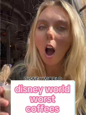 A young woman with long blonde hair is the central focus, her face filling a significant portion of the frame. She has an open mouth expression, appearing surprised or mid-speech. The background is blurred, suggesting an outdoor setting. Overlayed on the image is a text box with the words 'disney world worst coffees' in pink letters.