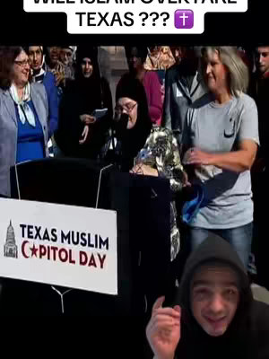 The image shows a man in a black hoodie in the foreground. Behind him is a group of people, some wearing hijabs. There's a sign that says "Texas Muslim Capitol Day." The hook text reads "Will Islam overtake Texas ???" with a cross symbol.