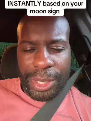 The cover image shows a close-up of a Black man's face in a car setting. He appears to be looking down with his eyes almost closed, wearing a pink t-shirt or sweater and a seatbelt. The lighting suggests a nighttime environment, with warm tones on his face and a dark background.