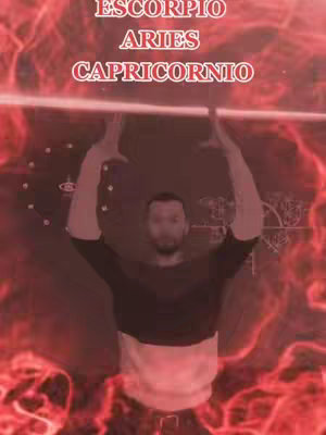 The cover image shows a man with his arms raised, appearing to hold a beam of light, surrounded by red, fiery effects. The text overlay at the top lists zodiac signs.