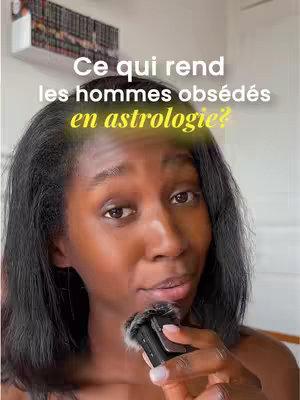A woman with dark hair speaks into a microphone, set against a blurred background of a room. Text overlays the image questioning why men are obsessed with astrology.