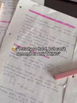 A close-up shot of a sheet of paper filled with handwritten notes. Some text is highlighted in pink marker. At the bottom of the image, there's a text overlay with a quote, and a small cartoon face.