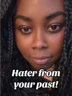 A close-up shot features a woman with dark skin, dark hair styled in braids, and brown eyes. The focus is on her face, which is centered in the frame. Below her face, bold white text reads, "Hater from your past!"