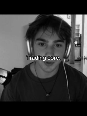 A grayscale selfie of a young man with a headset, the text overlayed 'Trading core.' The background is blurred walls and a door, enhancing the focus on the man.