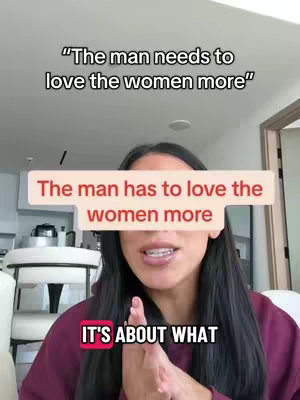 A woman with long dark hair is centered in the frame, speaking to the camera. Above her head, there is a text overlay that reads, "The man needs to love the women more." A second text overlay, in a red box, partially covering her forehead says, "The man has to love the women more." In the lower corner, the text "IT'S ABOUT WHAT" is visible in a smaller framed text box.
