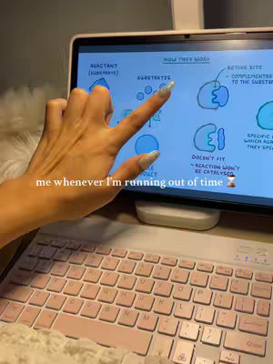 A person's hand points to a tablet screen displaying a biology diagram about enzyme reactions. A pink keyboard is visible in the foreground.