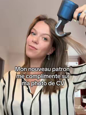 A woman brushes her hair with a styling tool, with text overlayed on the image.