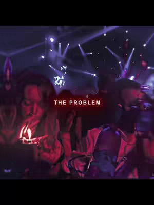 The cover image is a dimly lit shot featuring two silhouetted figures in a blurred setting, possibly a concert or event. Overlayed in bold red text are the words "THE PROBLEM". The figures are set against a backdrop of illuminated spotlights and stage lighting, creating a dramatic atmosphere.