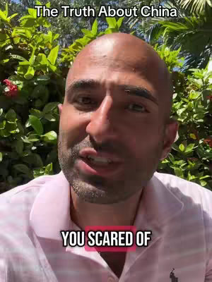 A man with a shaved head is centered in the frame, the background consists of green leafy plants. The foreground shows the man wearing a light pink collared shirt with the polo logo. Text overlays are at the top and bottom of the image.