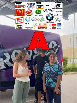 A group of people standing in front of a purple van with a large red 'A' overlaid on the image. Above, a grid of brand logos, and a woman holding a microphone.