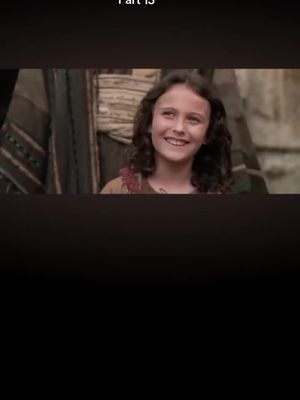 The cover image features a smiling young person with curly hair, set against a softly blurred background. The person, who appears to be a young girl, seems to be indoors, possibly in a historical setting, given the attire and environment. The lighting is warm, highlighting the person's face and creating a positive and inviting composition. The image has a vintage feel. The text overlay is white.