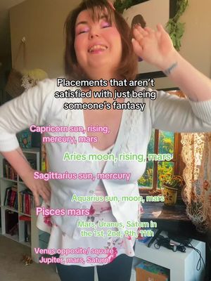 A woman smiles at the camera with her hair up. Text overlays are added that list astrological placements.