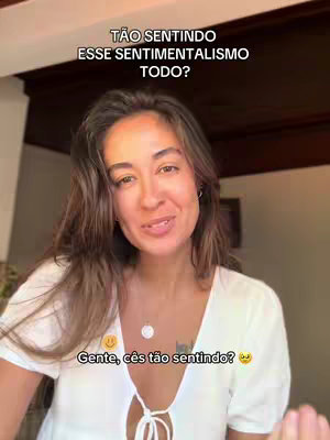 A woman with long brown hair is looking at the camera and smiling, with text overlaid at the top and the bottom of the image. She is wearing a white top. The background is blurred, but appears to be an interior setting.