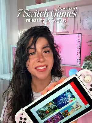 A woman with long dark hair smiles at the camera while holding a Nintendo Switch. Text overlays the top left of the image and reads "7 Switch Games releasing in August." The background has a blurred room with a computer screen visible.