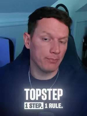 A close-up of a man in a navy blue shirt, with text overlaid at the bottom. He is looking to the side, his expression thoughtful. The background is softly lit, suggesting an indoor setting. The text is arranged in three lines, with a glow effect.