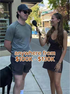 A street interview scene featuring a man and a woman. The man, wearing a baseball cap and sunglasses, is being interviewed by a woman holding a microphone. Behind them is a street scene with buildings and a black dog on a leash. Text overlaid on the image indicates a salary range.