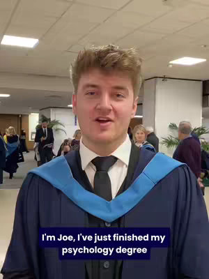 The cover image features a young man, Joe, standing indoors. He is wearing a graduation gown and a tie, with a serious expression. The background is blurred, with hints of a hallway and other people. Text overlayed at the bottom reads, "I'm Joe, I've just finished my psychology degree."