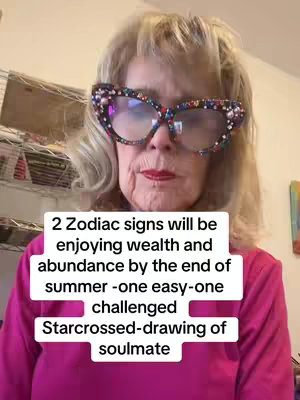 An older woman with blonde hair and large, bejeweled glasses is looking directly into the camera. A text overlay with white text sits below her on the image.