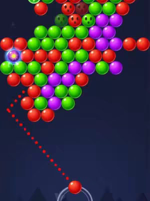 An overhead view of a mobile game screen featuring a bubble shooter. Various colored bubbles are arranged in a cluster at the top, with a red bubble ready to be launched from the bottom, indicated by a dotted trajectory line.