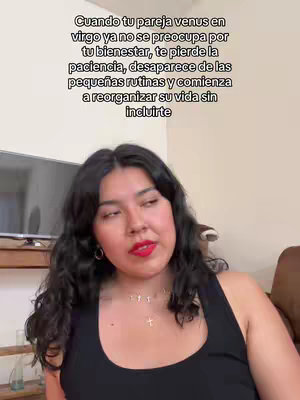 A woman with dark hair and red lipstick is looking slightly to her right. Text is overlaid at the top of the frame.