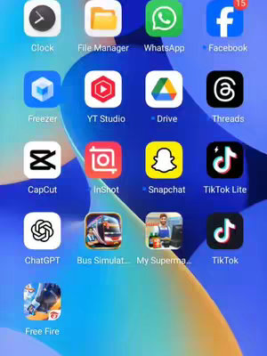 A screenshot of a phone's home screen with app icons arranged in a grid against a gradient blue background. The icons feature various app logos, including social media, utility, and game applications.