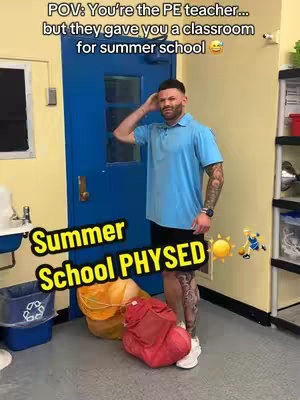A man in a blue polo shirt and black shorts stands in a doorway with a blue door. The room has a trash can, a sink, and a shelf. Yellow text that says 'Summer School PHYSED' overlays the image. A text overlay says 'POV: You're the PE teacher...but they gave you a classroom for summer school'.