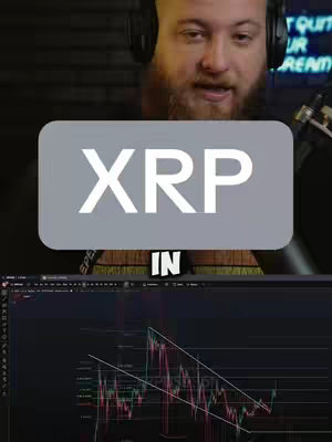 The cover image features a man in the upper third of the frame, centered and looking towards the viewer. He wears headphones and has a beard. Overlayed on top of him is a gray rounded rectangle with the white text "XRP". Below the man and the text overlay is a graph depicting a downward trending price chart in red and green.