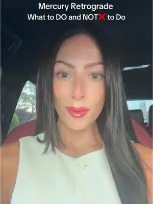 A woman with long dark hair is centered in the frame, her face is the focus. She's looking straight at the camera with red lipstick. Above her head, text says 'Mercury Retrograde, What to DO and NOT to Do', with the 'NOT' crossed out.