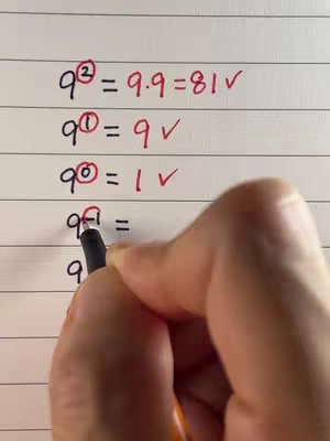 A hand holding a pen is writing on a white lined paper. The paper contains handwritten math equations about exponents. The top of the paper has math equations and a checkmark. The equations go from the positive number to the power of 0. The hand with the pen is writing on the bottom of the paper to complete the exponent equation.